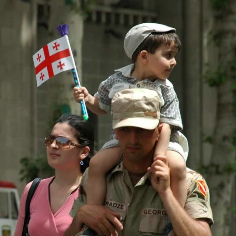 Father Carrying Son - Tbilisi, Georgia