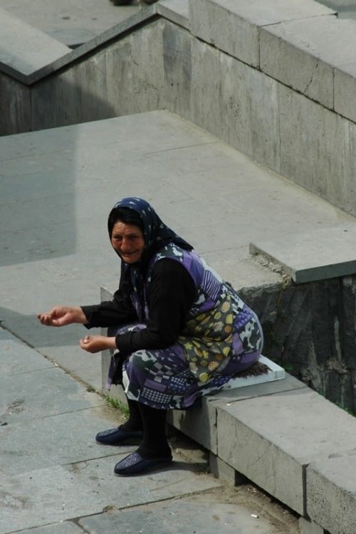 Woman Begging at the Church Steps - Tbilisi, Georgia