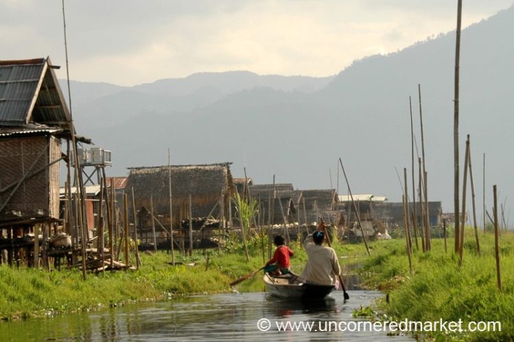 Women Paddling on Waterway of Burma