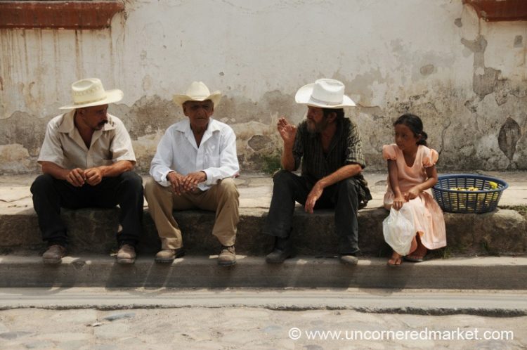 Hondurans on Street Curb