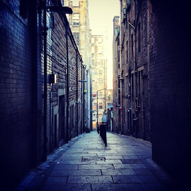 One of the open "closes" (private alleyways) off High Street - Edinburgh, Scotland